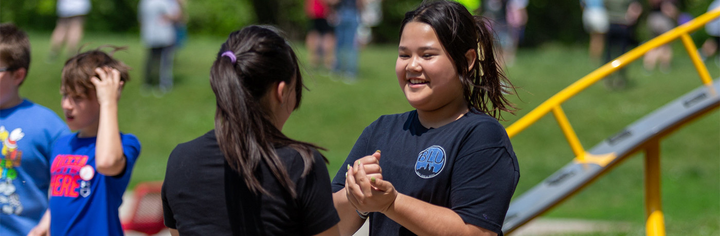 students playing rock paper scissors